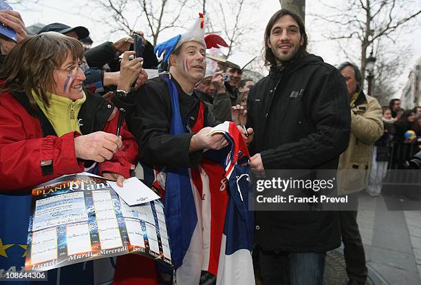France's national handball team player Bertrand Gille signs autographs on Champs-Elysees on January 31, 2011 in Paris, France. France's handball wins...