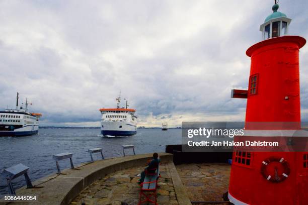 lighthouse and ferries by the øresund strait - oresund region stock pictures, royalty-free photos & images