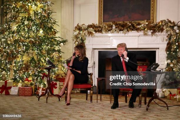 President Donald Trump and first lady Melania Trump as they track Santa Claus's movements with the North American Aerospace Defense Command Santa...