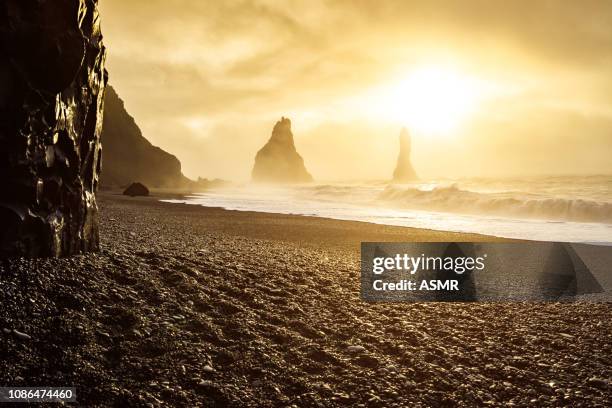 reynisfjara black sand beach during sunrise - lava stone stock pictures, royalty-free photos & images