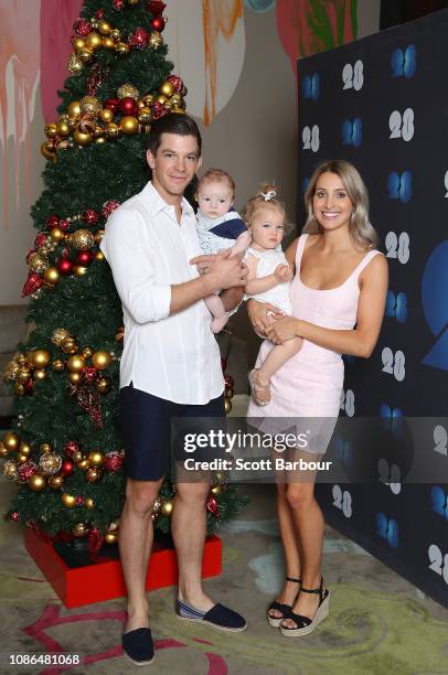 Australian captain Tim Paine along with his children Milla and Charlie and his wife Bonnie Maggs pose next to a Christmas tree during an Australian...