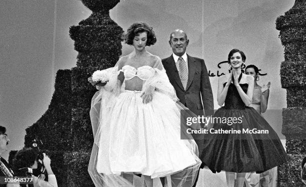 Oscar De La Renta and models on runway after a show of his fashions in the mid 1990s in New York City, New York.