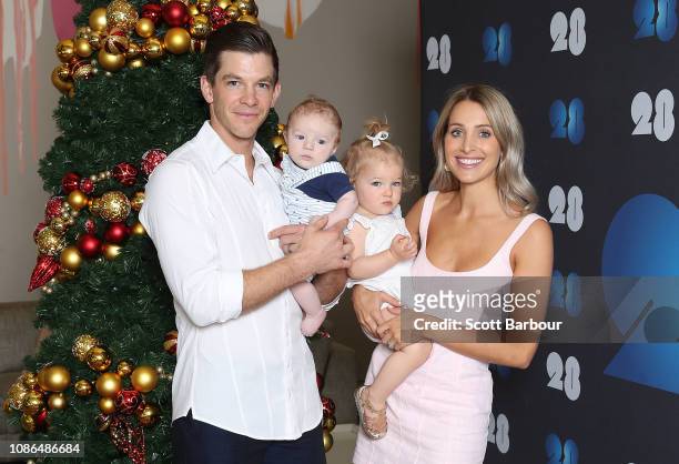Australian captain Tim Paine along with his children Milla and Charlie and his wife Bonnie Maggs pose next to a Christmas tree during an Australian...