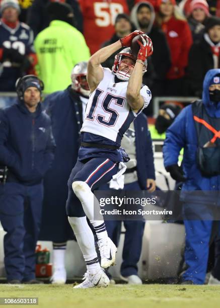 New England Patriots wide receiver Chris Hogan hauls in a 10-yard reception on the first play of overtime of the AFC Championship Game game between...