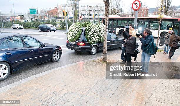 The Spanish press pursues the hearse and family car of Carlota Canto Cobo on the way to her funeral on January 31, 2011 in Barcelona, Spain.