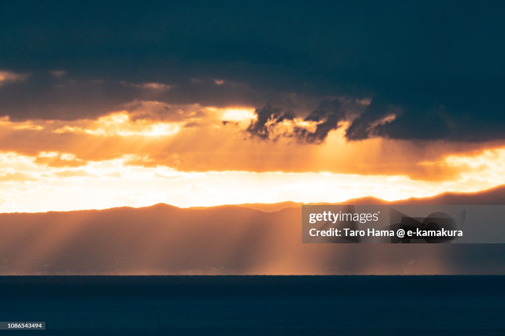 Orange-colored sunset sunbeam on Izu Peninsula and Sagami Bay, Pacific Ocean in Japan