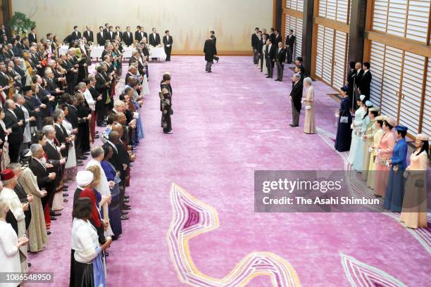 Emperor Akihito attends the 'Chakai-no-Gi' tea party celebrating his 85th birthday with Empress Michiko, Crown Prince Naruhito, Prince Akishino,...