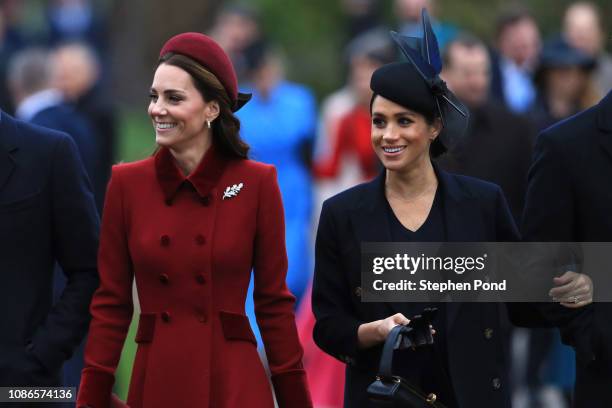 Catherine, Duchess of Cambridge and Meghan, Duchess of Sussex arrive to attend Christmas Day Church service at Church of St Mary Magdalene on the...