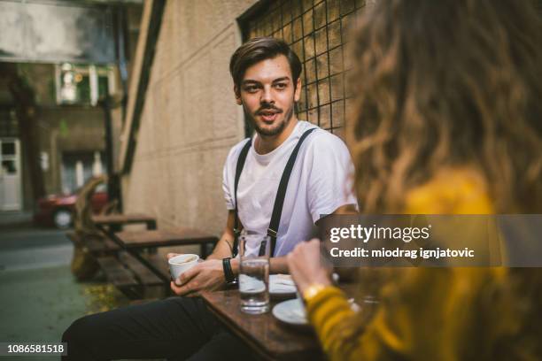 beautiful man at cafe - sidewalk cafe stock pictures, royalty-free photos & images