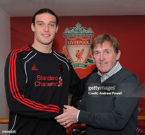 Manager of Liverpool Kenny Dalglish shakes hands with his new record signing Andy Carroll at Melwood Training Ground on January 31, 2011 in...