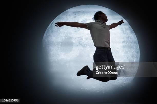 mature man looking at full moon in sky at night - looking up at stars stock pictures, royalty-free photos & images