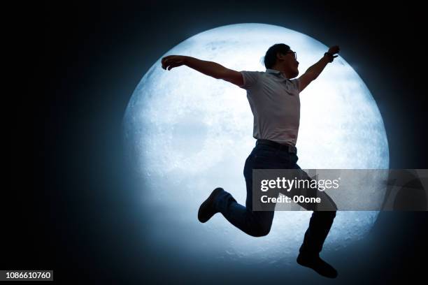 mature man looking at full moon in sky at night - looking up at stars stock pictures, royalty-free photos & images