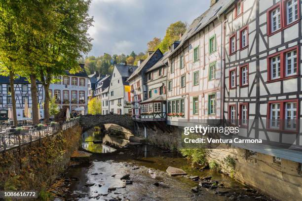 half-timbered houses on the rur river in monschau, germany - aachen foto e immagini stock