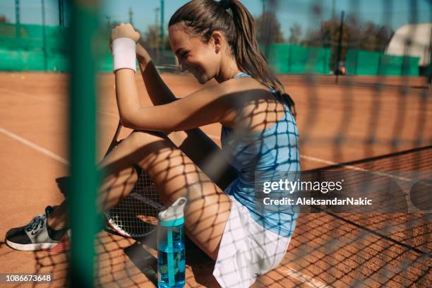 resting after the match - tennis net stock pictures, royalty-free photos & images