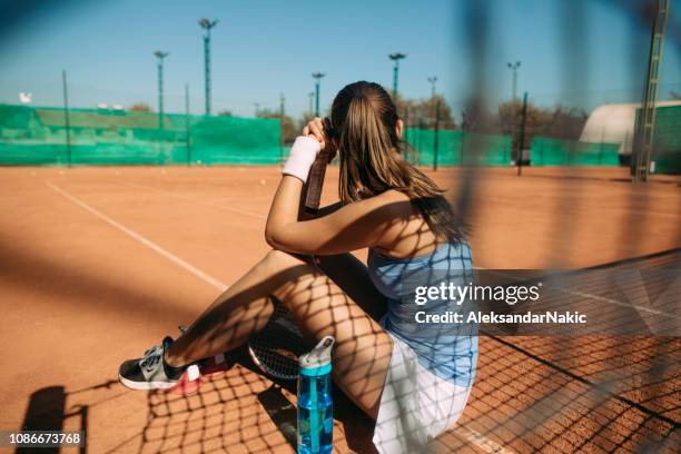 resting after the match - tennis net stock pictures, royalty-free photos & images