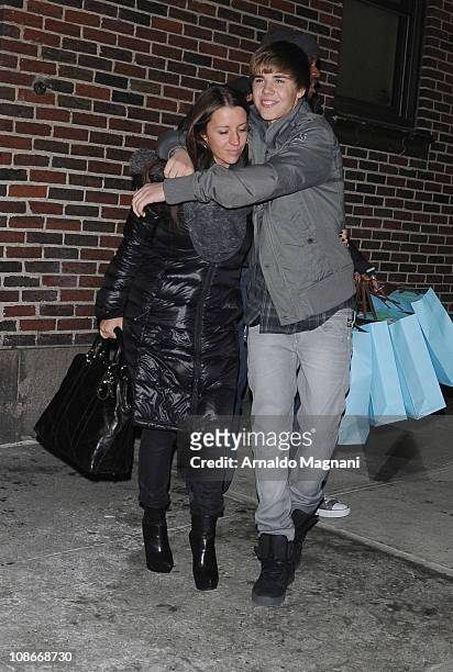 Pattie Mallette and Justin Bieber walk in the city on January 31, 2011 in New York City.