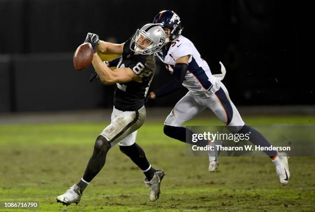 Jordy Nelson of the Oakland Raiders watches the ball go off his fingertips against the Denver Broncos during the second half of their NFL football...