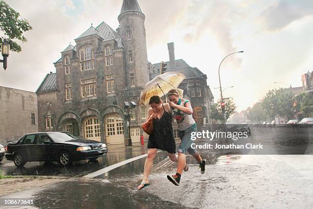 storm on street - montreal people stock pictures, royalty-free photos & images