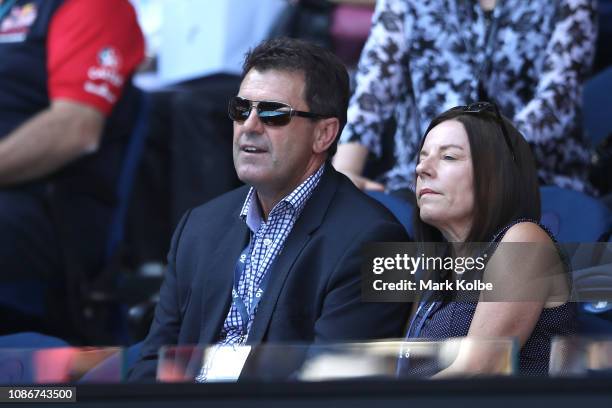 Former Australian cricketer Mark Taylor watches the quarter final match against Milos Raonic of Canada and Lucas Pouille of France during day 10 of...