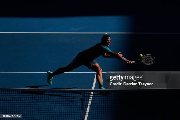 Milos Raonic of Canada plays a backhand in his quarter final match against Lucas Pouille of France during day 10 of the 2019 Australian Open at...