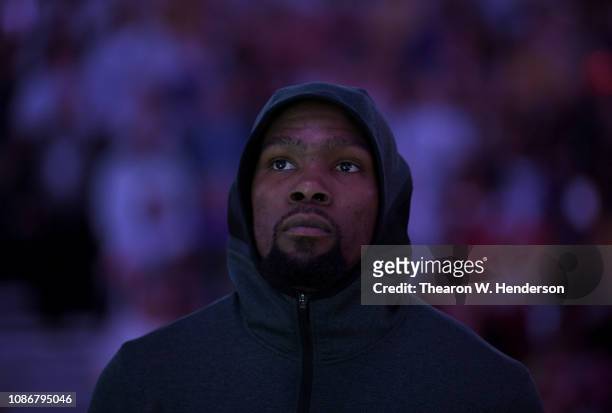 Kevin Durant of the Golden State Warriors stands for the National Anthem prior to the start of an NBA basketball game against the Los Angeles Lakers...
