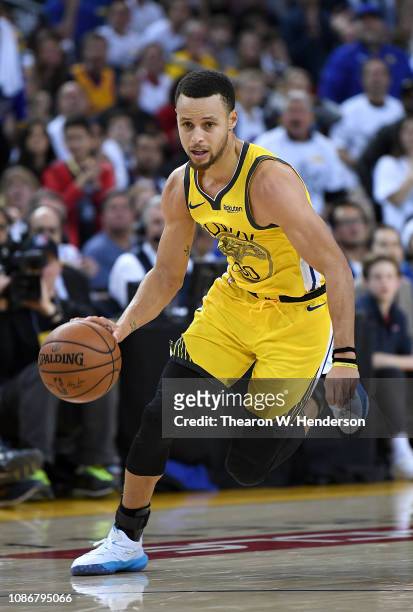 Stephen Curry of the Golden State Warriorsd dribbles the ball up court against the Los Angeles Lakers during the second half of their NBA Basketball...