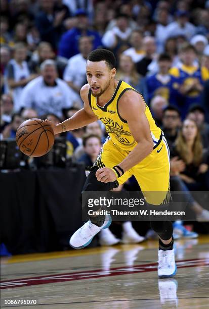 Stephen Curry of the Golden State Warriorsd dribbles the ball up court against the Los Angeles Lakers during the second half of their NBA Basketball...