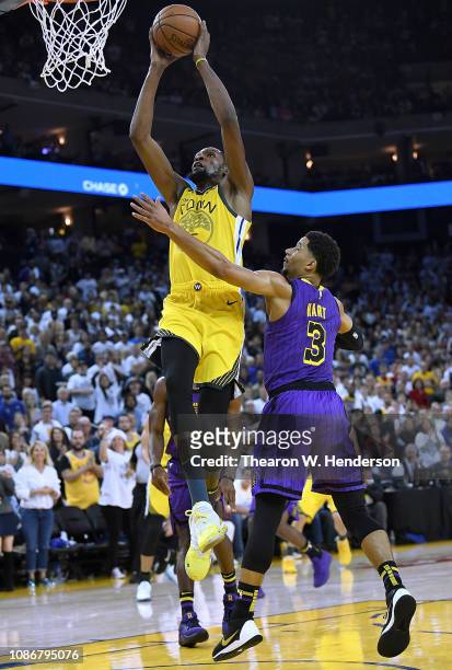 Kevin Durant of the Golden State Warriors goes up for a slam dunk against the Los Angeles Lakers during the second half of their NBA Basketball game...