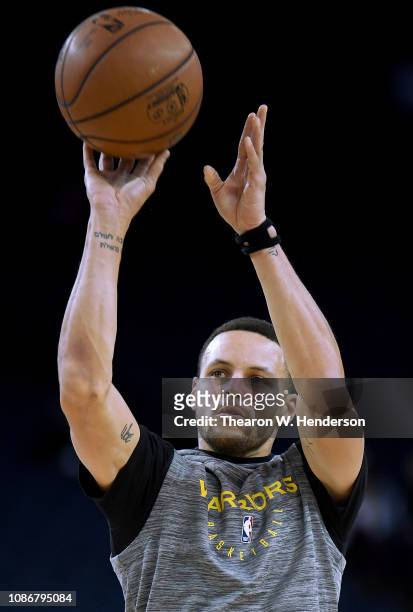 Stephen Curry of the Golden State Warriors warms up prior to the start of an NBA basketball game against the Los Angeles Lakers at ORACLE Arena on...
