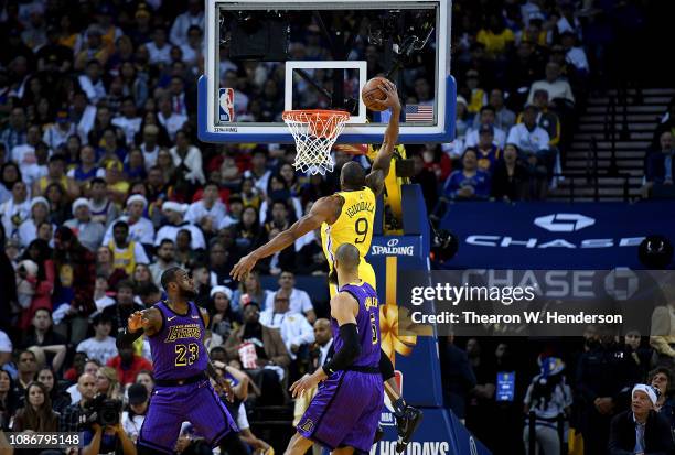 Andre Iguodala of the Golden State Warriors goes in for a slam dunk against the Los Angeles Lakers during the first half of their NBA Basketball game...