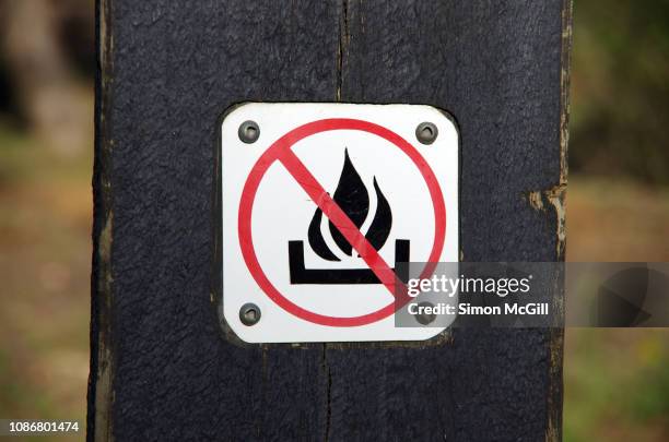 'no fires' sign on a wooden post in canberra nature park, canberra, australian capital territory, australia - forbidden sign stock pictures, royalty-free photos & images