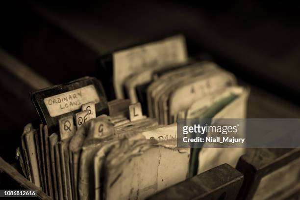 index cards from an abandoned library card catalogue cabinet - file photo stock pictures, royalty-free photos & images