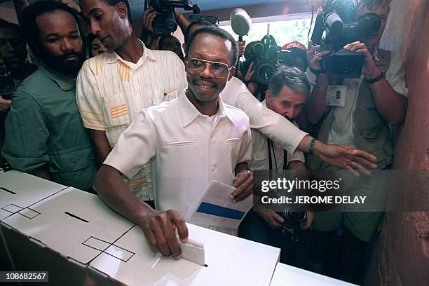 Haitian presidential candidate Father Jean-Bertrand Aristide casts one of his ballots 16 December 1990 in Port-au-Prince during Haiti's presidential...