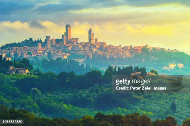 san gimignano in tuscany, italy at sunrise - san gimignano stock pictures, royalty-free photos & images