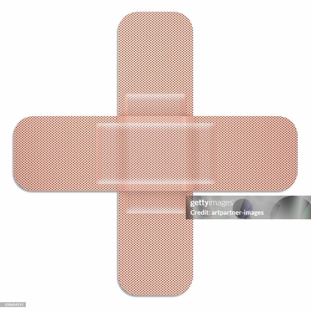 Crossed Adhesive Bandages on White Background