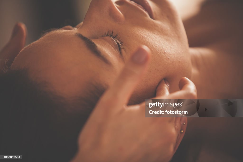 Woman enjoying head massage