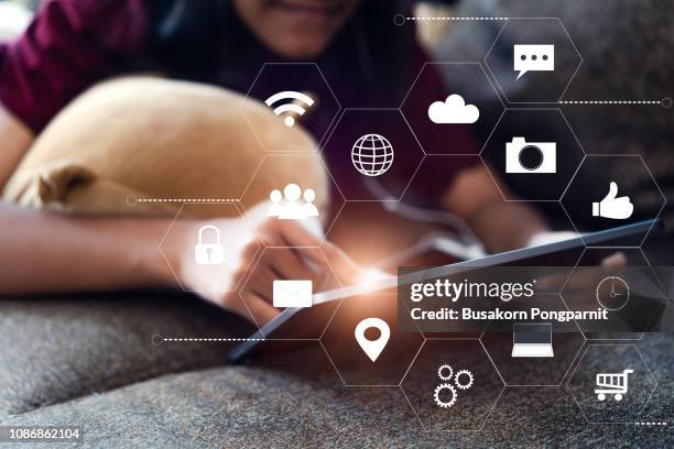 woman hands touching tablet with virtual icon diagram network technology - digital communication stock-fotos und bilder