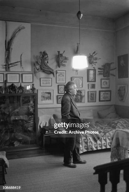 French writer Andre Breton , a founder of the Surrealist movement, at home in France with his art collection, circa 1960.