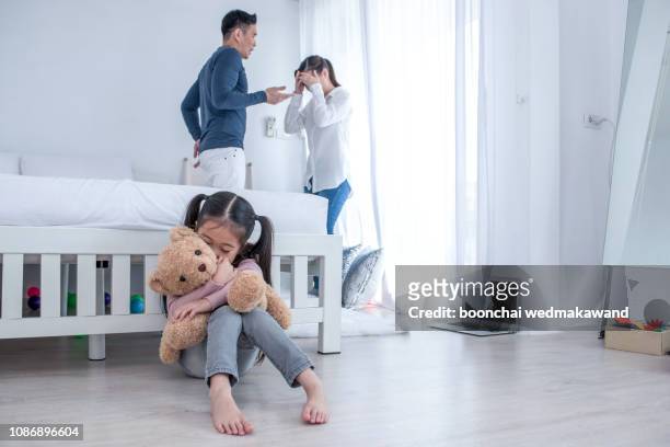 the concept of parental family quarrels, young couple parents are fighting in front of children. the children are very sad to the parents quarrel. children are crying and headaches. - divorce kids stock pictures, royalty-free photos & images