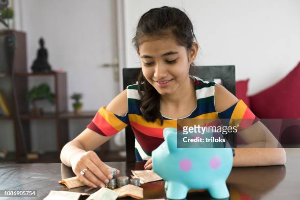 girl with her savings - indian economy stock pictures, royalty-free photos & images