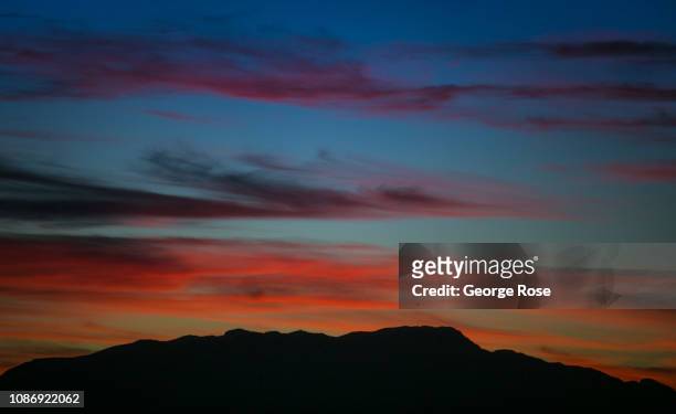 Colorful sunset over the mountains is viewed from the Las Vegas Strip on December 19, 2018 in Las Vegas, Nevada. During the Christmas and New Year...