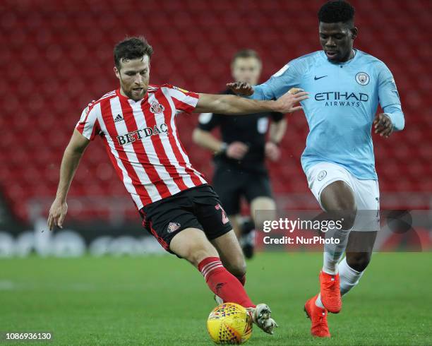 .Adam Matthews of Sunderland in action with Jeremie Frimpong of Manchester City during the Checkatrade Trophy Quarter Final match between Sunderland...