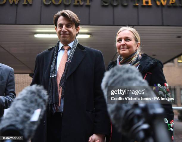 Former Tesco UK finance director Carl Rogberg, with his wife Amanda, makes a statement outside Southwark Crown Court, where he has been acquitted...