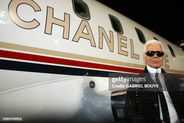 German designer Karl Lagerfeld poses next to a Chanel jet after the 2007/08 Chanel Cruise Show he presented at the Santa Monica Airport, California,...
