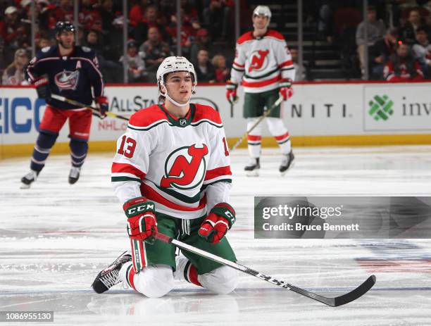 Nico Hischier of the New Jersey Devils stretches before playing against the Columbus Blue Jackets at the Prudential Center on December 23, 2018 in...