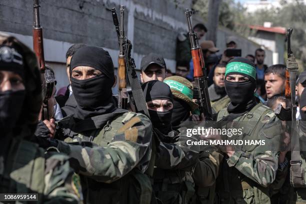 Masked Hamas gunmen attend the funeral of Mahmoud al-Nabaheen in the Bureij refugee camp, in the central Gaza Strip, on January 23, 2019. - The Hamas...