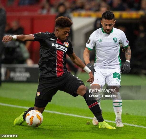 Leon Bailey of Bayer 04 Leverkusen and Wanderson of Ludogorets battle for the ball during the UEFA Europa League Group A match between Bayer 04...