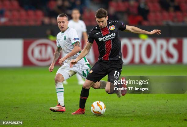 Jacek Goralski of Ludogorets and Lucas Alario of Bayer 04 Leverkusen battle for the ball during the UEFA Europa League Group A match between Bayer 04...