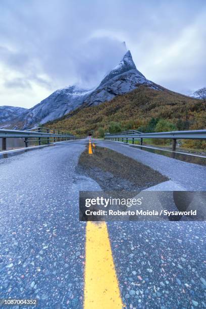 asphalt road towards stetind, norway - stetind stock pictures, royalty-free photos & images
