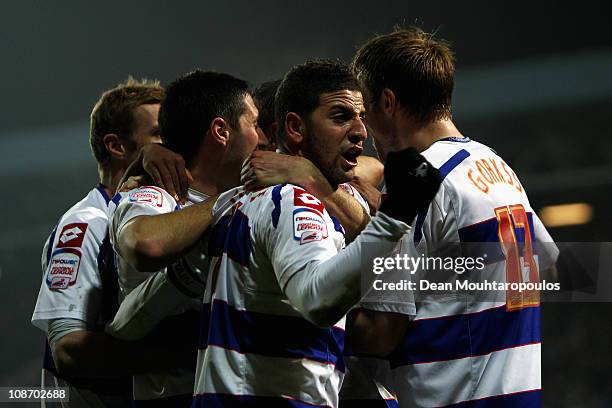 Clint Hill of QPR celebrates scoring the second goal of the game with team mates after he heads in a Adel Taarabt corner during the npower...